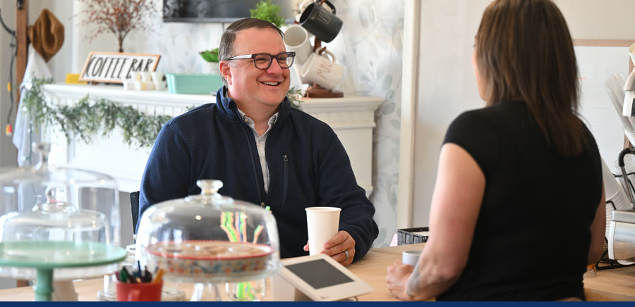 Matt Hall meeting with a local small business owner
